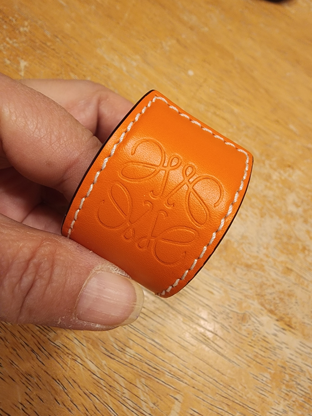 orange Loewe Small Slap Bracelet featuring the brand's debossed Anagram logo